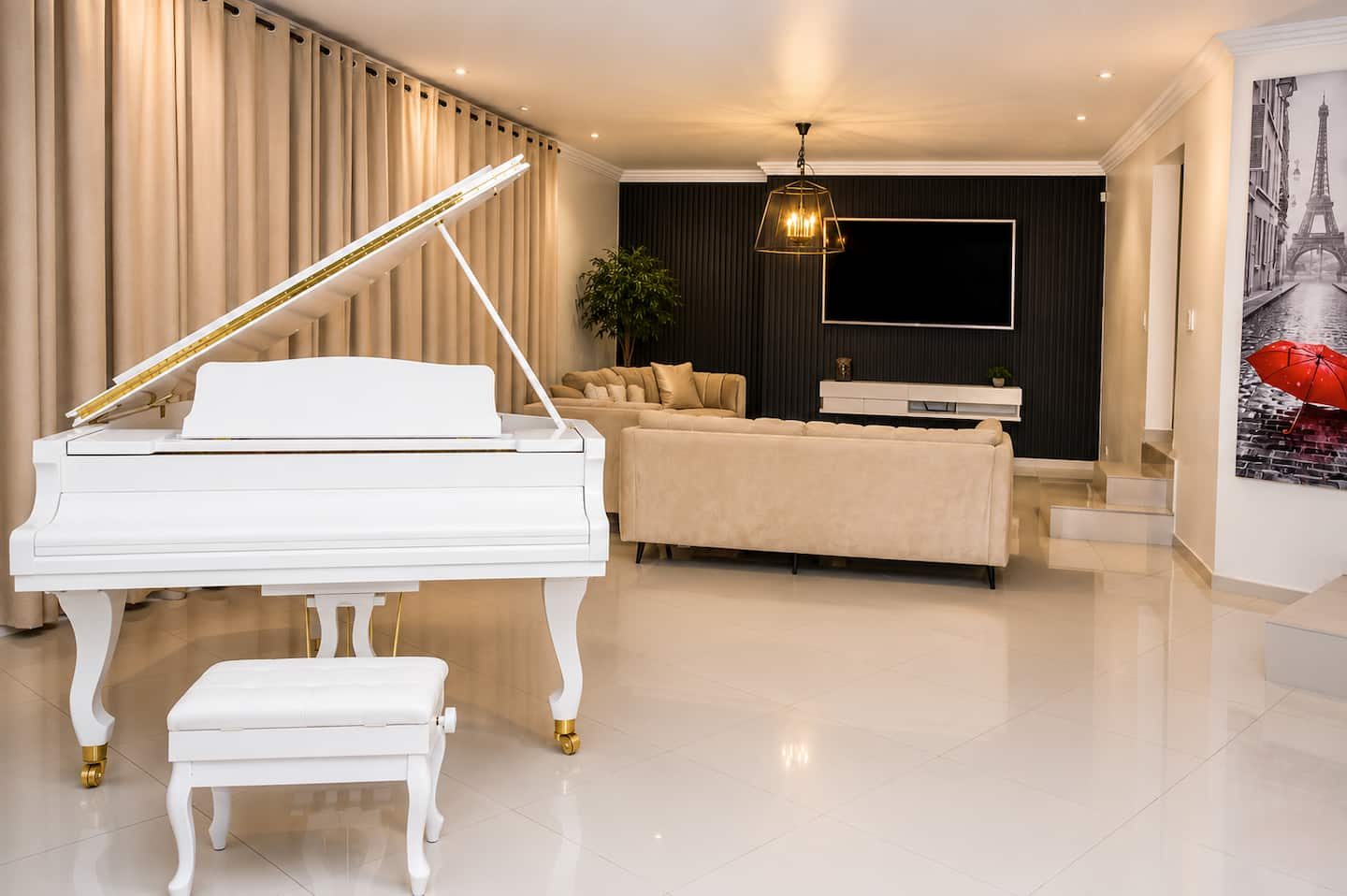 Lounge with white baby grand piano